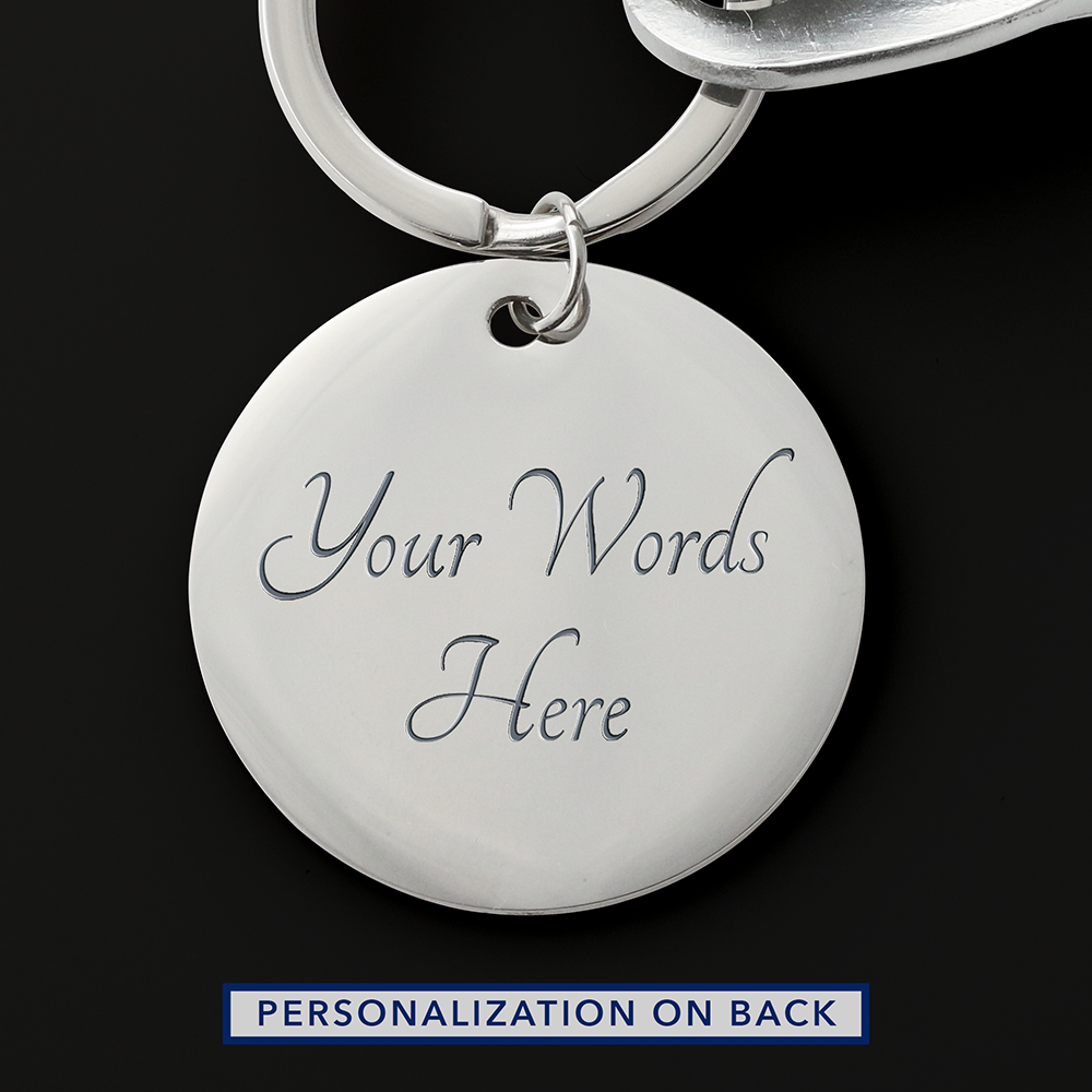 Reverse of the silver round keychain tag showing an example two-line engraving