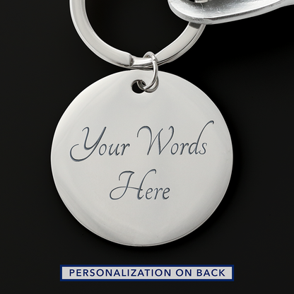 Reverse of the silver round keychain tag showing an example two-line engraving