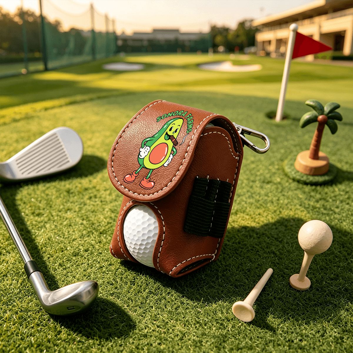 Brown golf ball pouch with sample Sonora Farms logo and side tee loops