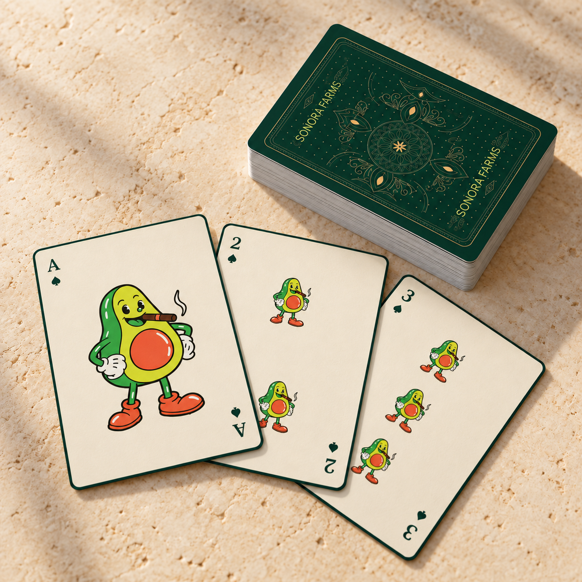 Personalized company playing cards with an avocado logo, Sonora Farms card back and three sample card faces